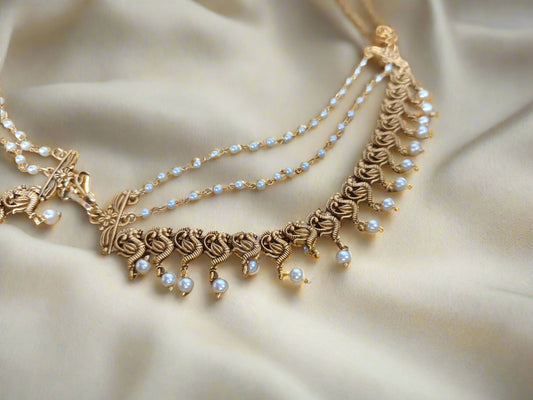 Temple jewelry hair-to-ear chain
Traditional hair-to-ear accessories
South Indian hair-to-ear connectors
Temple design jhumar chain
Antique gold hair-to-ear chain
Bridal hair chain earrings
Hair draping jewelry
Mattal / Maattal (Hair-to-ear chain)
Kemp Stone Hair Chain
Lakshmi Design Ear Chain
Antique Gold Maang Tikka with Ear Chain
Jadau Hair Chain Earrings
Traditional Pearl Maattal
