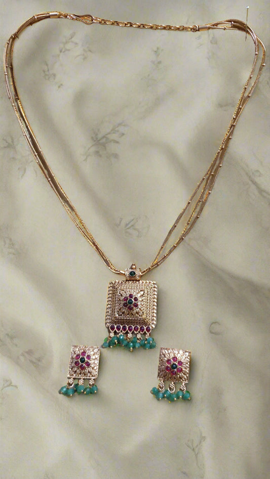3 layered Gold Chain with pendent and ruby and Emerlad with beads